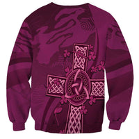 Maroon unisex sweatshirt with Celtic knot cross graphic on back