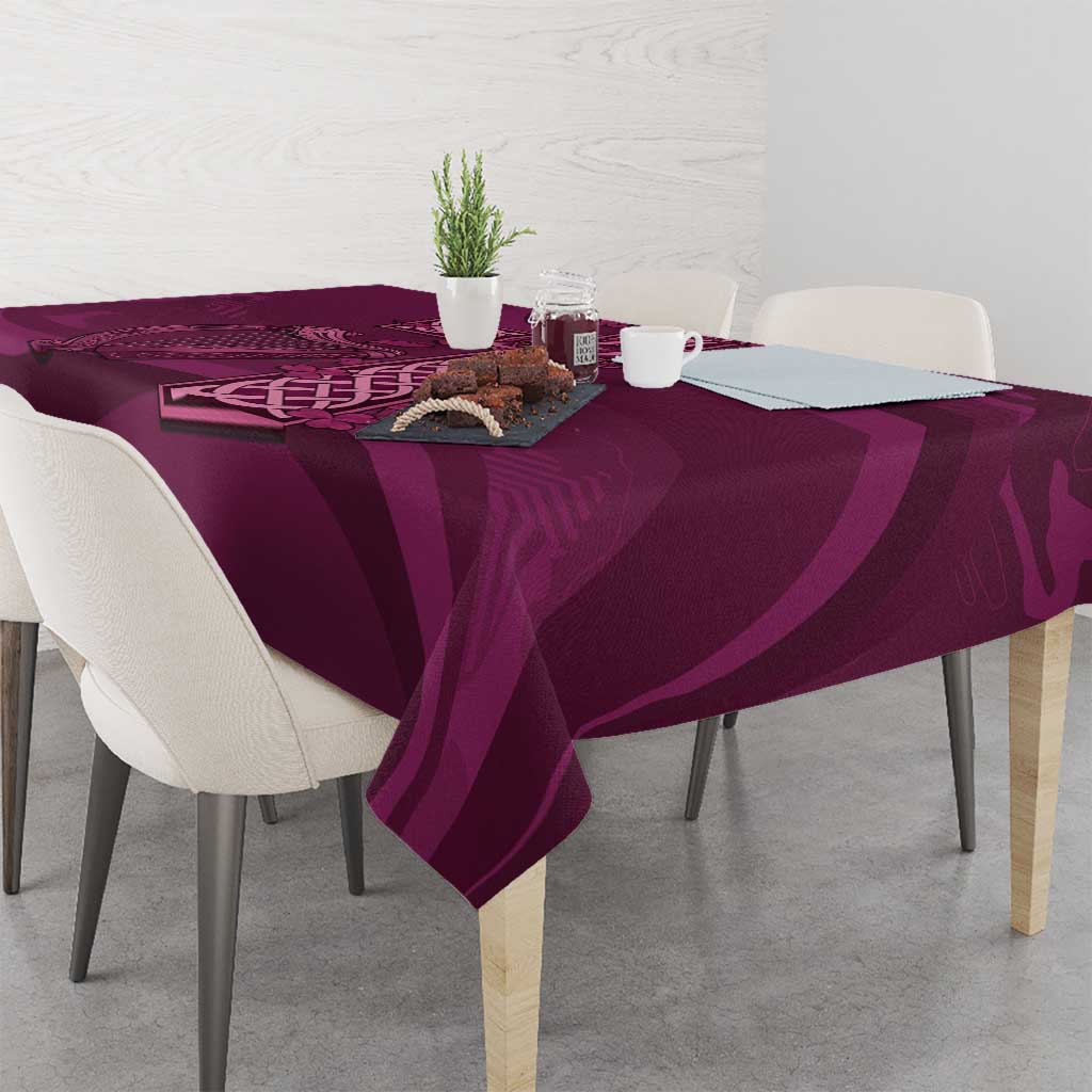 Maroon Celtic knot tablecloth on dining table with small decor and repeating pattern