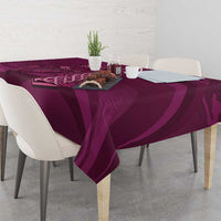 Maroon Celtic knot tablecloth on dining table with small decor and repeating pattern