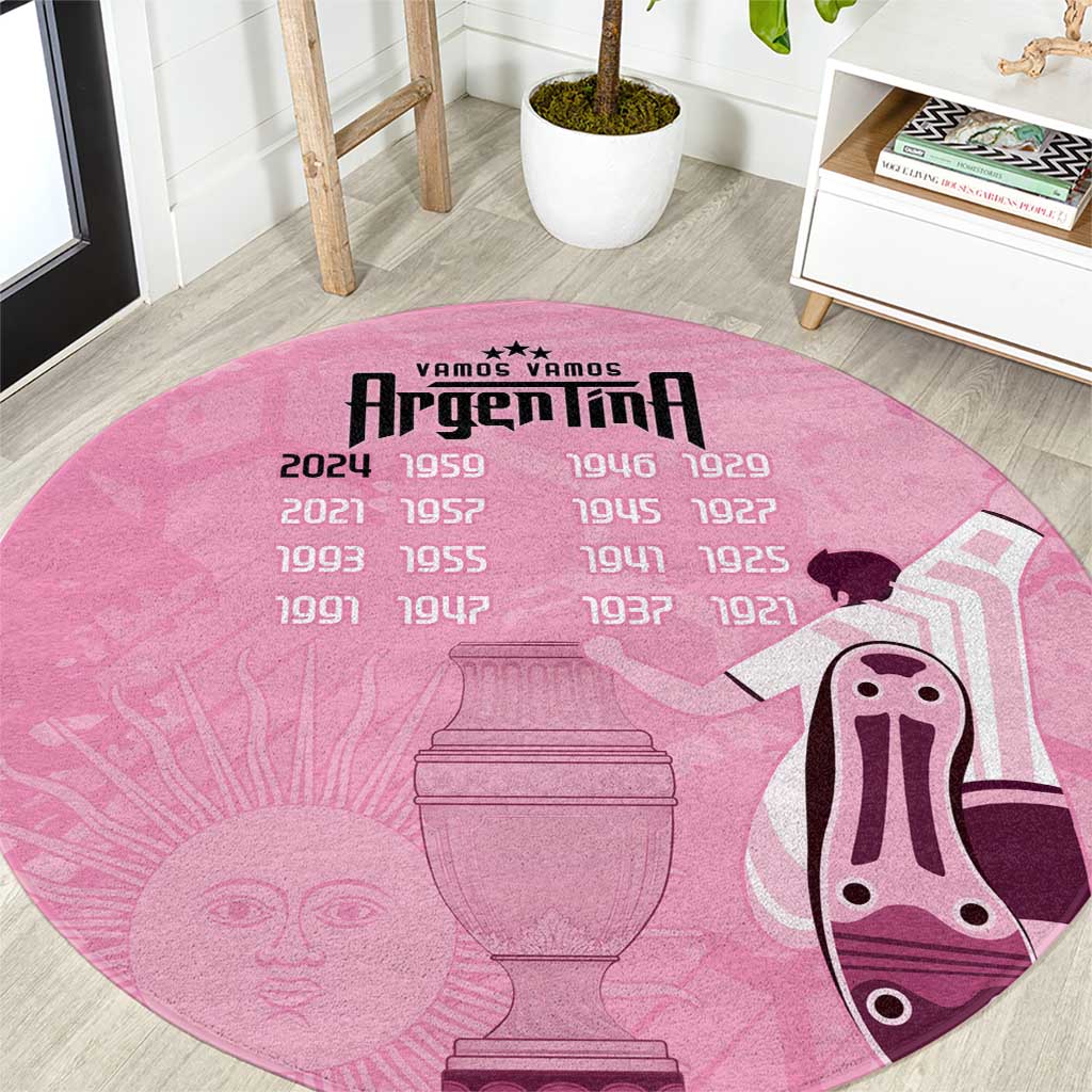 Pink round Argentina football rug with large central trophy and cow-face graphic