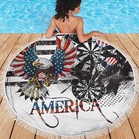 Round beach blanket showing bald eagle, American flag wings, darts wheel, 'AMERICA' fringe