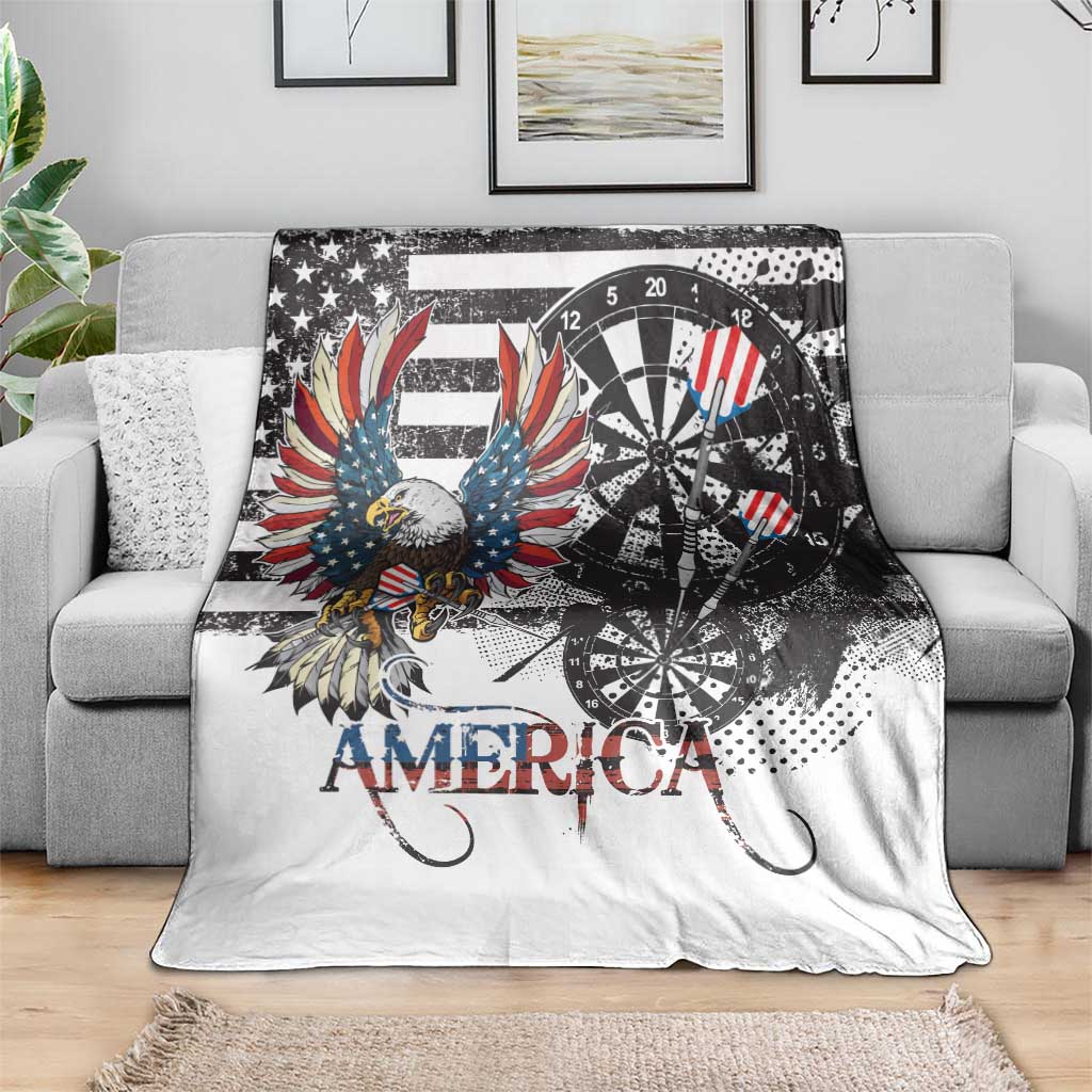 White American eagle and dartboard graphic blanket draped over a couch with “AMERICA”