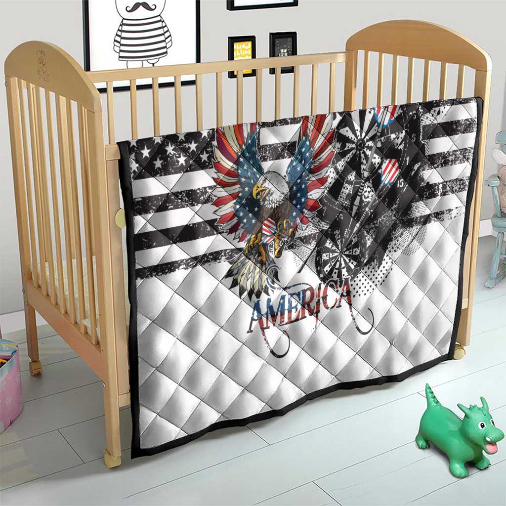 White quilt laid over crib mattress with bald eagle over dartboard and American stripes