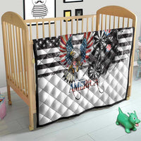 White quilt laid over crib mattress with bald eagle over dartboard and American stripes