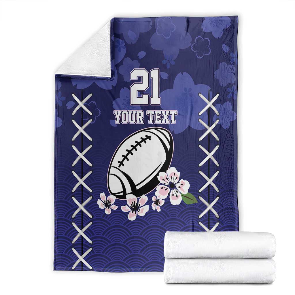 Blue rugby throw blanket, number 21 football and floral design, stacked with white backing