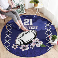 Navy-blue round rugby rug with “21 YOUR TEXT” football, cherry blossom flowers, and wave pattern