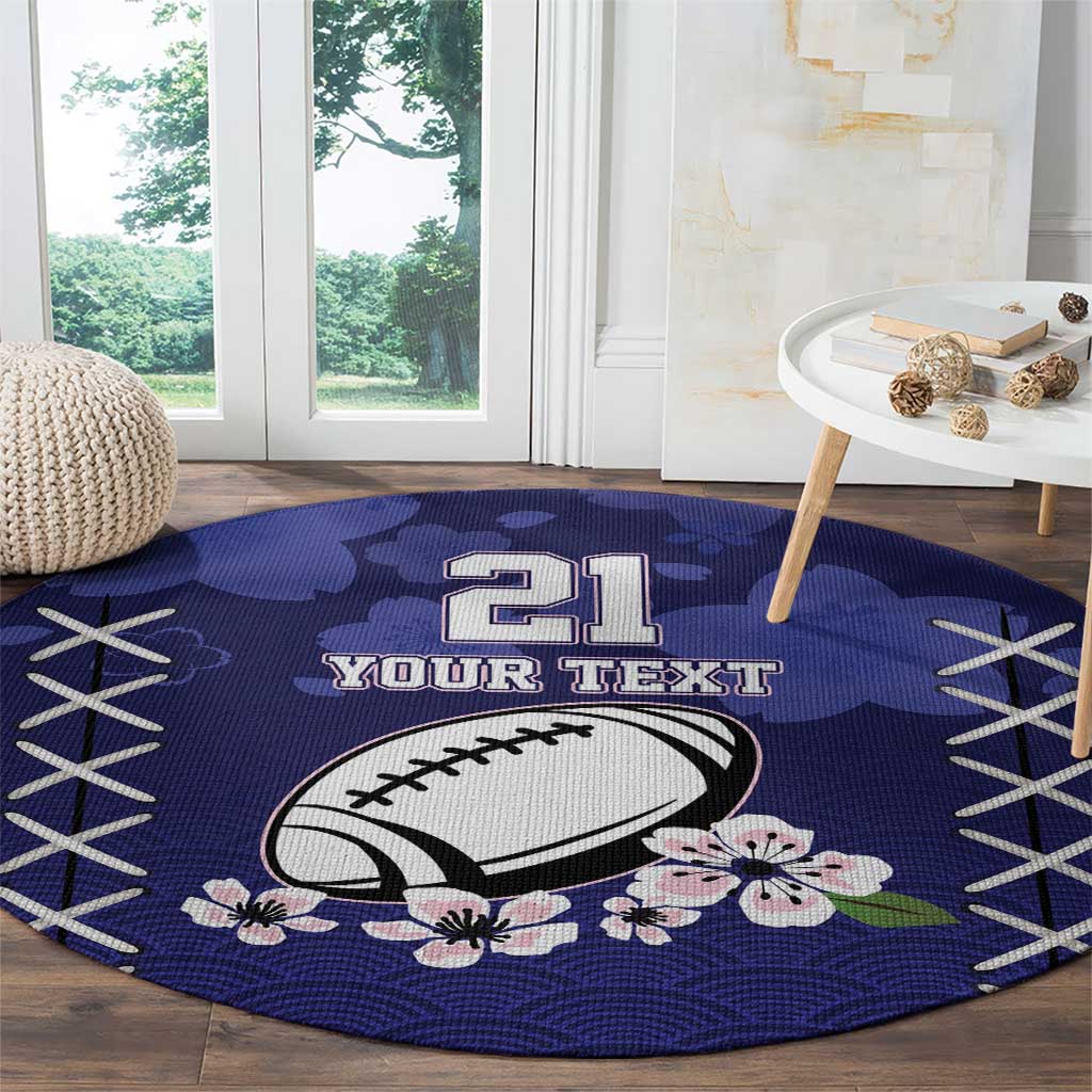 Blue round rugby-themed area rug with “21” and football, floral accents and crisscross stitching