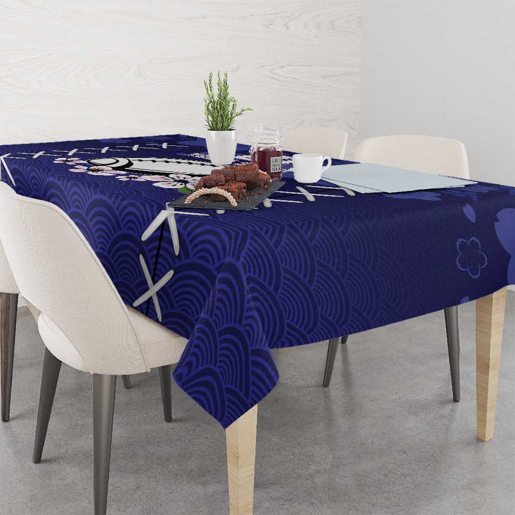Blue tablecloth with wave pattern and white X shapes across the table edge