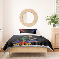 Black duvet bedding set with “1804” and bold Haiti-themed graphics on a bed.
