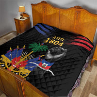 Black quilt on bed with “AYITI 1804” text, raised fist, palm tree, cannon and Haiti flag