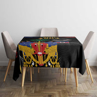 Black tablecloth with Haitian 1804 artwork centered on dining table