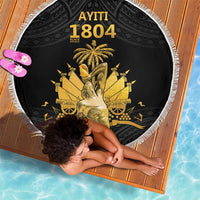 Black round beach blanket with white fringe edge and gold AYTITI 1804 design