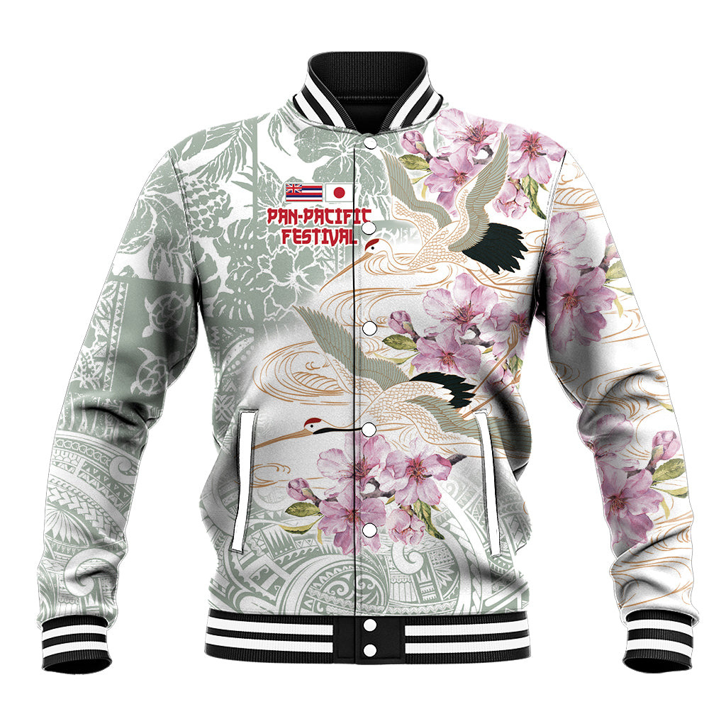 White baseball jacket with green and pink floral bird print, snap front and ribbed collar