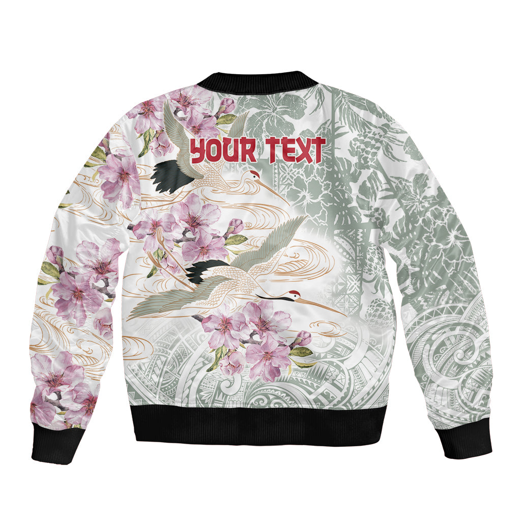 Unisex bomber jacket with white floral and bird graphic, black ribbed cuffs and hem