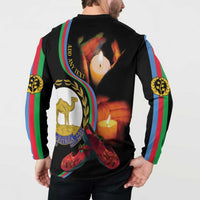 Black button henley sweatshirt with 'Eritrea' badge and candles in wreath on back