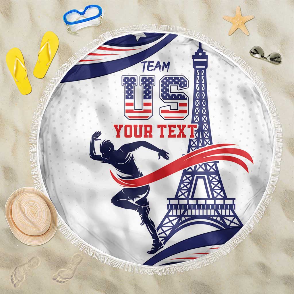 Round fringed beach blanket with navy/red USA athlete graphic and Eiffel Tower