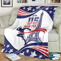 Sports blanket draped on a couch, showing team USA and text-style design