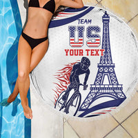 Round beach blanket with fringe edge, bike rider and Eiffel Tower in blue, red, and white