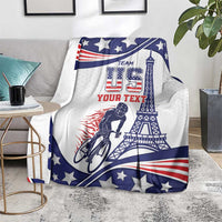 Personalized cycling blanket on living room seat with blue star print and Eiffel graphic