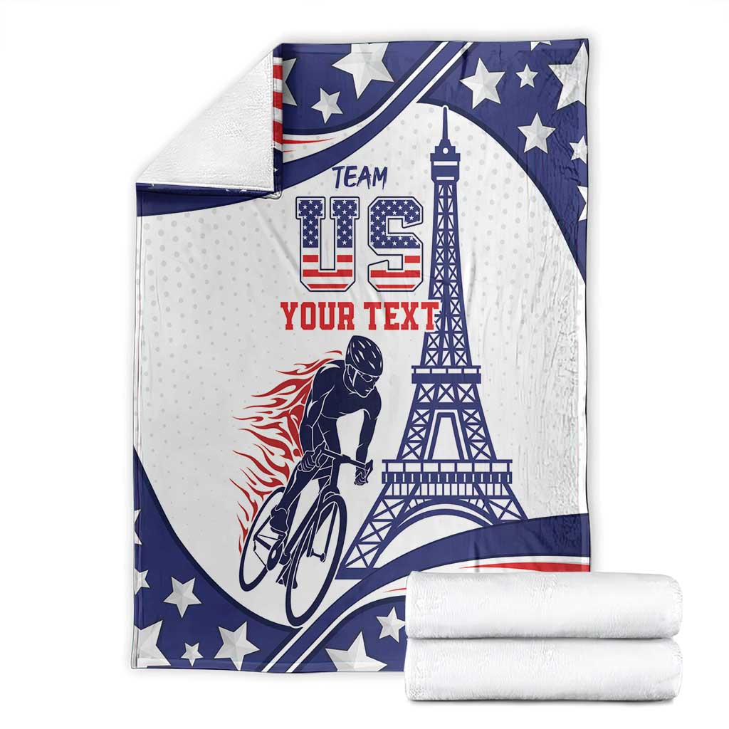 Personalized cycling blanket shown with folded stacks; blue, white, red stars and Eiffel