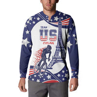 Blue button sweatshirt worn by man, star print with Eiffel tower and cyclist graphic.