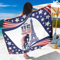 Blue patriotic sarong close-up with stars, red stripes, cyclist and Eiffel Tower artwork.