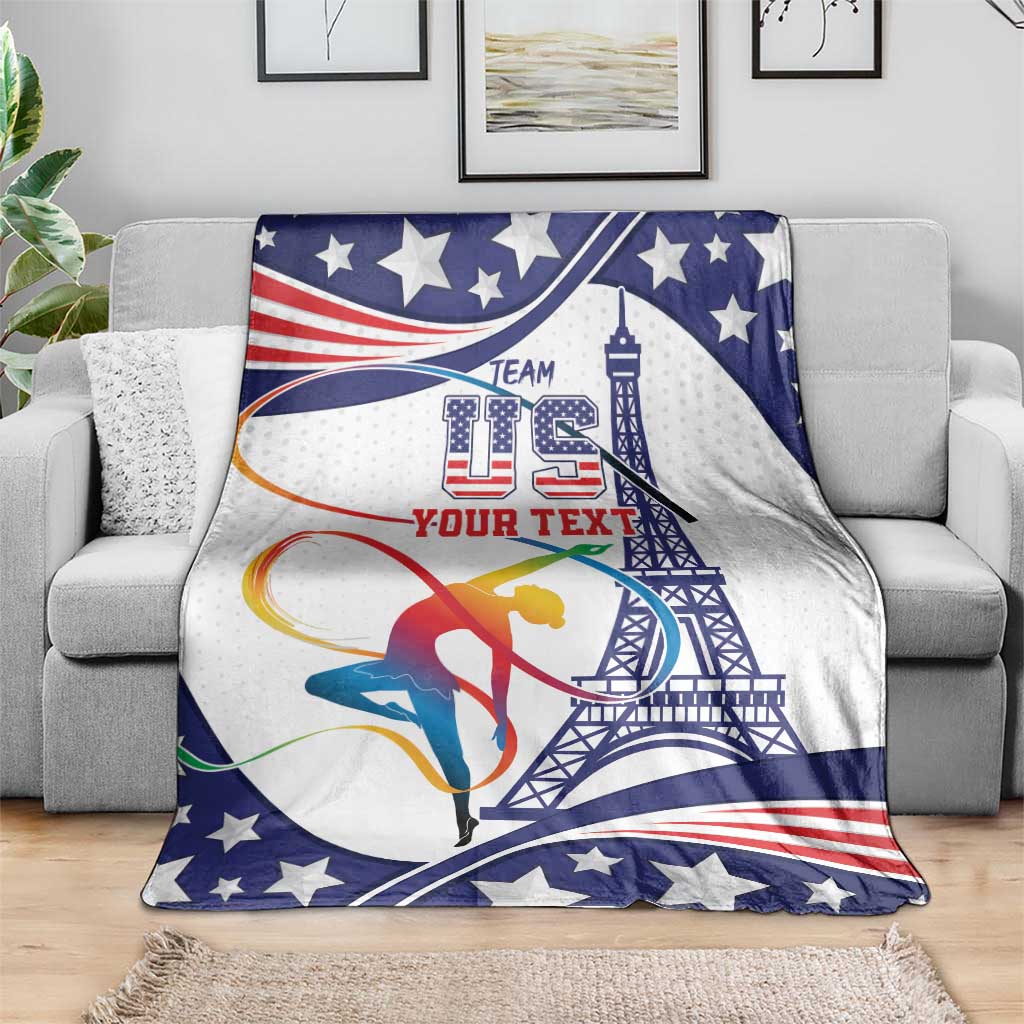 Gymnastics blanket draped on sofa, blue/white stars with gymnast and tower design