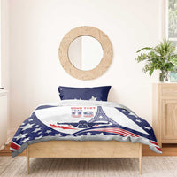 Blue and white bedding set with star pillows and Eiffel Tower-style duvet design