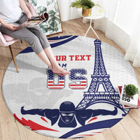 Round sports carpet on floor, white with blue-red swimmers and tower graphic