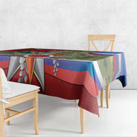 Patriotic tablecloth in red, blue, and green camo with large star bow centerpiece