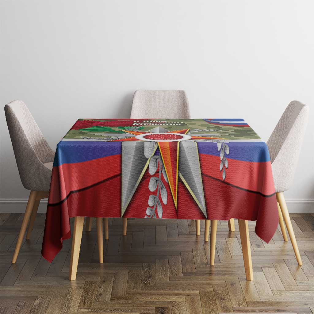 Patriotic tablecloth in red, blue, and green with star emblem, placed on dining table