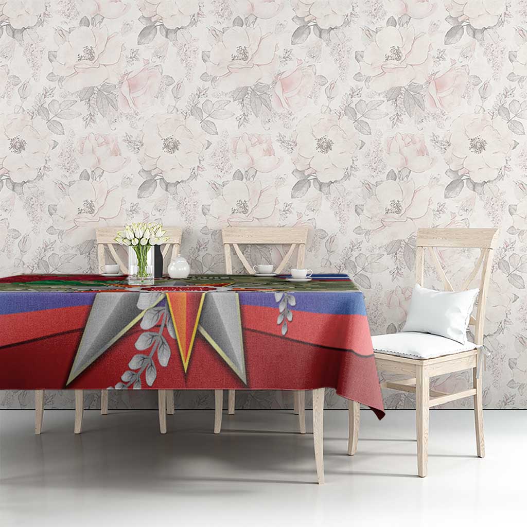 Patriotic tablecloth with star emblem, red and blue stripes, and green camouflage panel