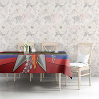 Patriotic tablecloth with star emblem, red and blue stripes, and green camouflage panel