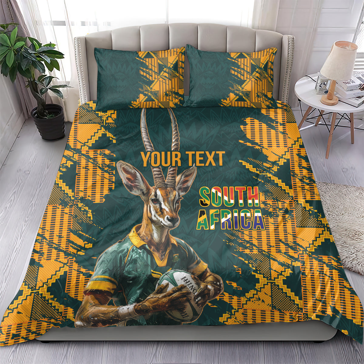 Green and yellow bedding set with gazelle mascot and South Africa text, on bed with two pillows