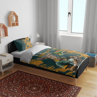 Green and yellow bedding set with gazelle mascot and South Africa text, duvet and pillowcases on bed