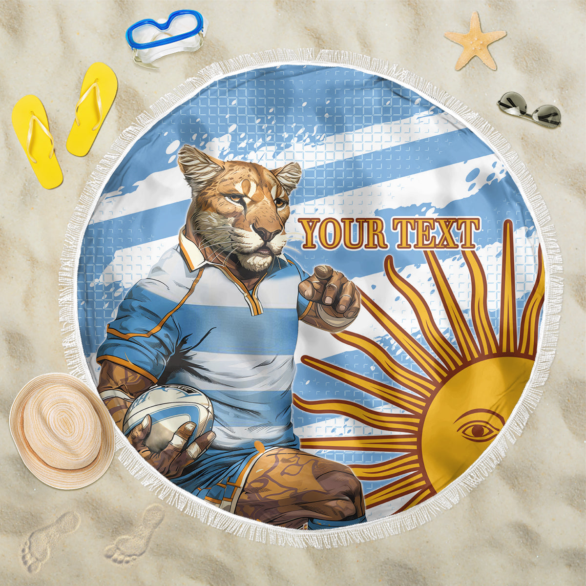 Round blue beach blanket with lion mascot, “YOUR TEXT” banner, fringed border.
