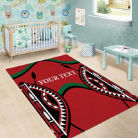 Red area rug with black and green tribal pattern and 'YOUR TEXT' in white