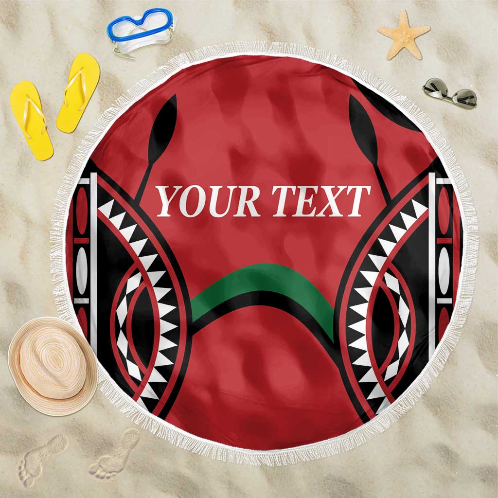 Round red beach blanket with fringe edge and black tribal pattern, custom 'YOUR TEXT'.