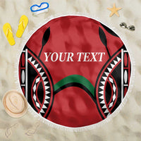 Round red beach blanket with fringe edge and black tribal pattern, custom 'YOUR TEXT'.