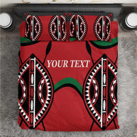 Red bedding set with bold black and white oval tribal motifs, green curved accents, “YOUR TEXT”.