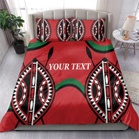 Red duvet cover with large black-and-white tribal emblems, green bands, and “YOUR TEXT”.