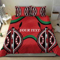 Red bedding set featuring black, white, and green tribal design with “YOUR TEXT” center.