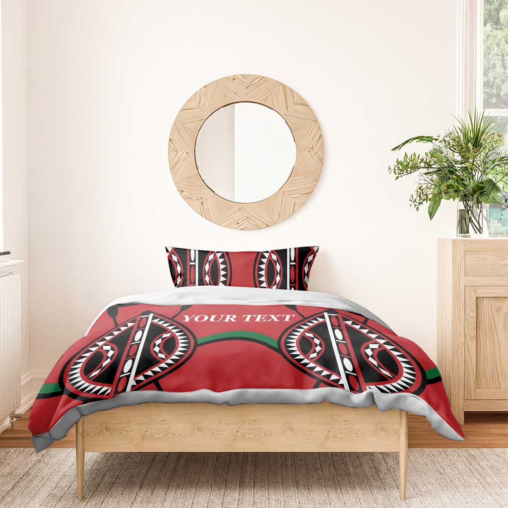 Red comforter-style bedding set with black-and-white tribal symbols, green accents, “YOUR TEXT”.