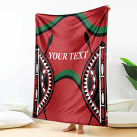 Red Kenya rugby blanket with “YOUR TEXT” and bold black-and-green tribal motifs.