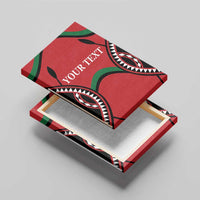 Red canvas wall art with black and green tribal pattern and 'YOUR TEXT' text, top corner view