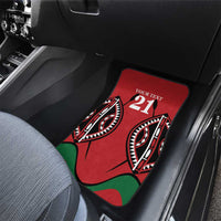 Red custom car floor mat with 21 logo and tribal-style design in the front seat