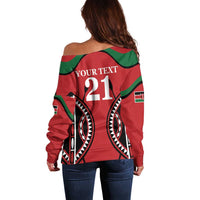 Red off-shoulder sweater with green shoulder stripes and 'YOUR TEXT 21' back print