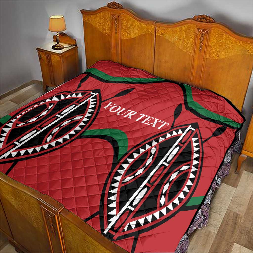 Red quilt blanket with diamond quilting, black outlines, green accents, custom text