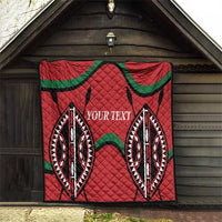 Red quilt blanket with diamond stitch texture, black and green emblem pattern, custom text