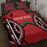 Red quilt bed set with black, white, and green tribal pattern and custom text